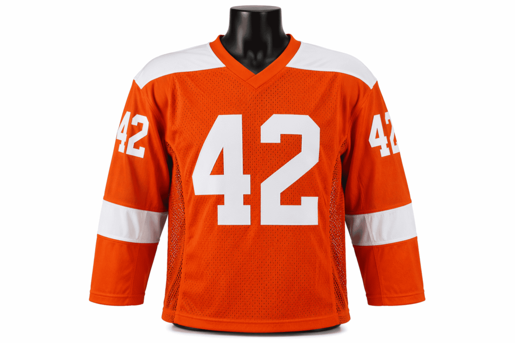 Hockey practice jersey bright orange with white shoulder yoke and large-hole mesh ventilation panels — custom heavy-duty reversible-ready training jersey with oversized fit for ice hockey teams and training camp programs