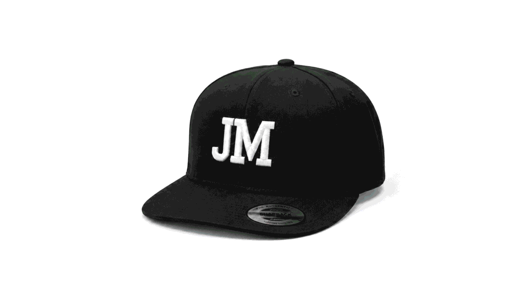 Custom black snapback hat with white 3D JM embroidery and structured flat brim