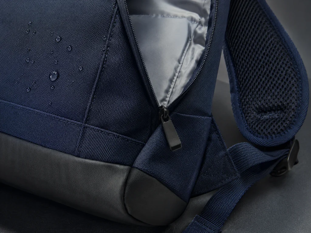 Close-up of durable school backpack fabric, breathable mesh strap, smooth lining and reinforced base