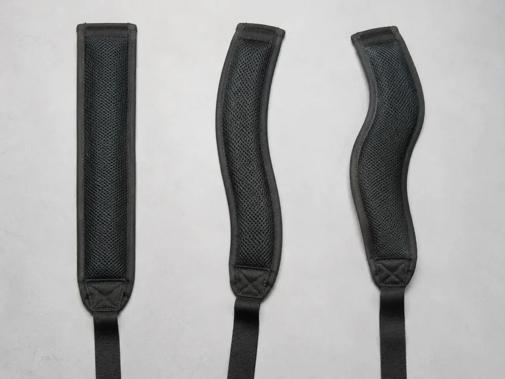 Physical strap prototypes reveal differences in curve, edge path, padded area, and webbing transition that a simple line drawing may hide.